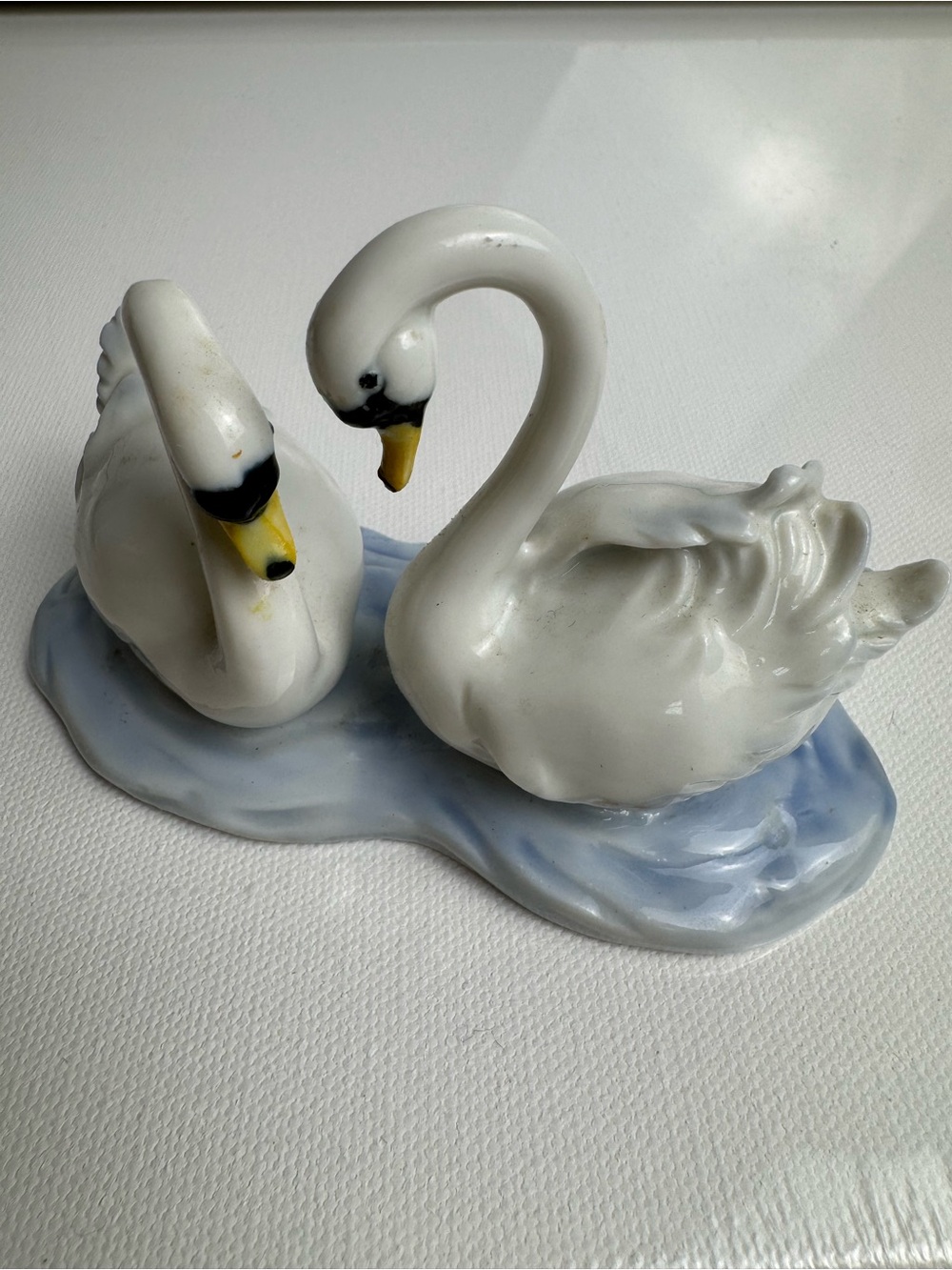 White Porcelain Swan Figurine Pair on Blue Water Base Bird Statue Decor